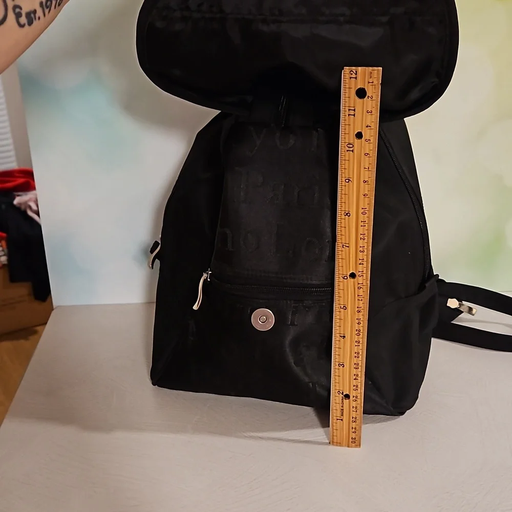 Black backpack convertible bag international city names on sections EUC